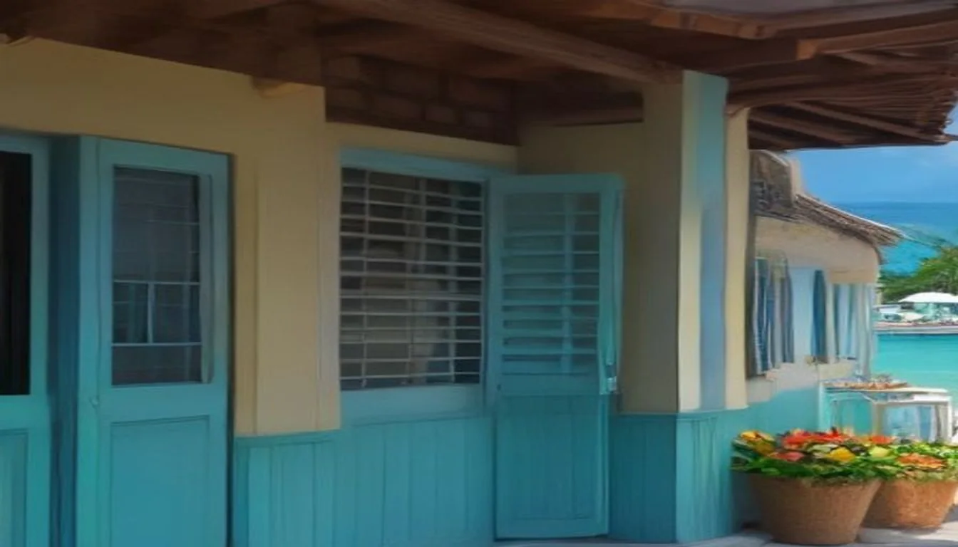 Création de site internet à Saint-Martin : boutique créole à volets bleus et lagon turquoise au fond
